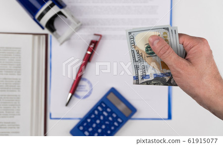 The hand that gives money 61915077