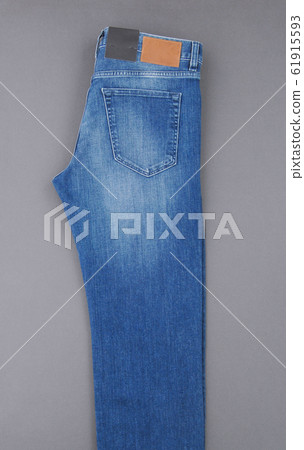 jeans on grey background jeans on grey background 61915593