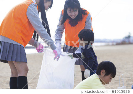 High school students and children doing local activities High school students and children doing local activities 61915926