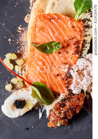 Closeup Salmon steak fillet with eggs and vegetables. Restaurant menu, a series of photos of different dishes Closeup Salmon steak fillet with eggs and vegetables. Restaurant menu, a series of photos of different dishes 61916476