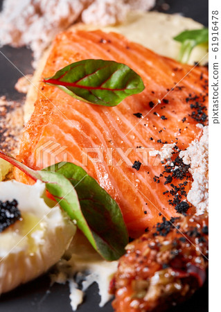 Closeup Salmon steak fillet with eggs and vegetables. Restaurant menu, a series of photos of different dishes Closeup Salmon steak fillet with eggs and vegetables. Restaurant menu, a series of photos of different dishes 61916478