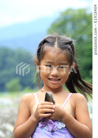 Girl enjoying fishing 61918404