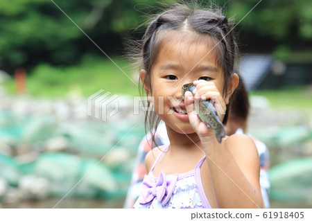 Girl enjoying fishing 61918405