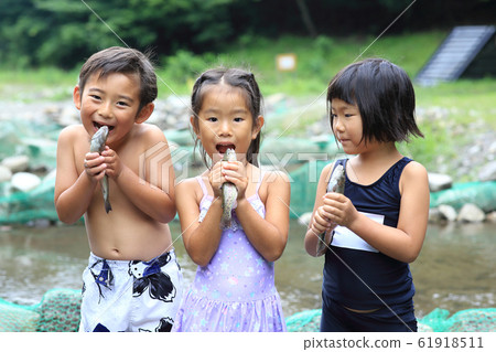 Children enjoying fishing Children enjoying fishing 61918511