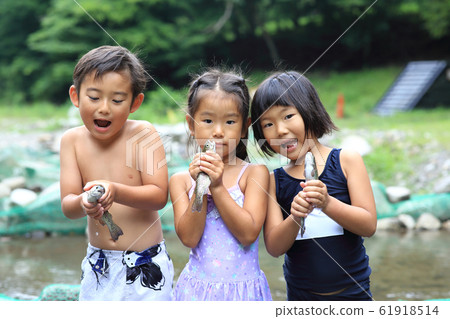 Children enjoying fishing Children enjoying fishing 61918514
