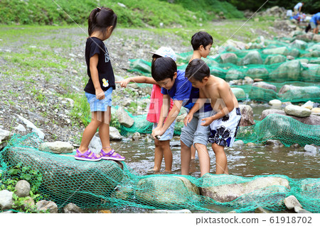 Children enjoying fishing Children enjoying fishing 61918702
