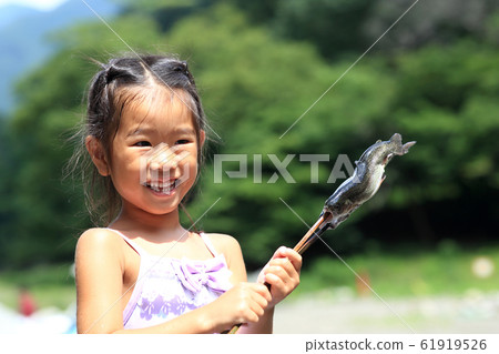 Children enjoying fishing Children enjoying fishing 61919526