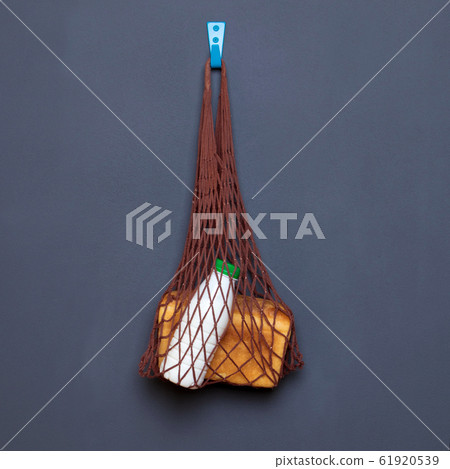 shopping bag with products on a gray background 61920539