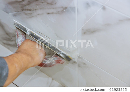 Grouting ceramic tiles process of filling the Grouting ceramic tiles process of filling the 61923235