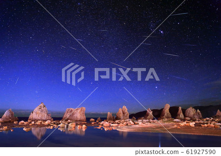 Geminids meteor shower and bridge pile rock 61927590