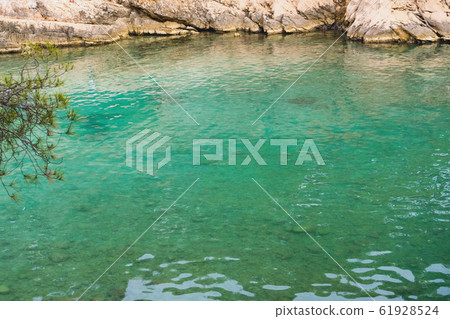 Beautiful landscape with turquoise water surface and rocky cliffs in Calanques National Park. 61928524