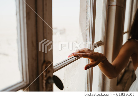 Young woman hand at old beautiful villa Young woman hand at old beautiful villa 61929105