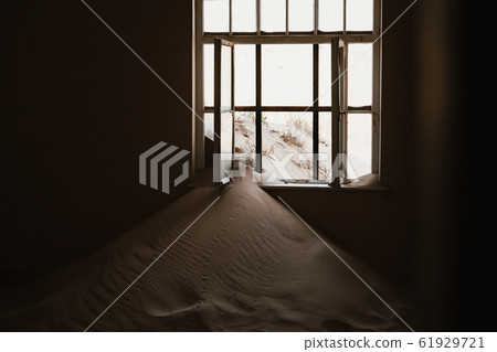desert sand has invaded and taken over these rooms in Kolmanskoppe, Namibia 61929721