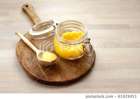 Ghee clarified butter desi in glass jar with spoon 61929953