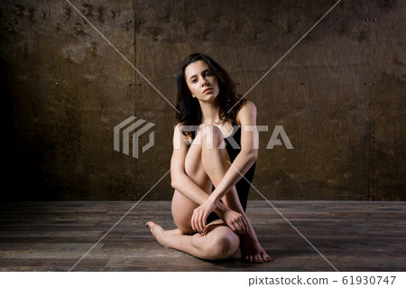 Abstract and stress emotional concept. depressed girl in lonely mood, theme of stressful. Sad woman sitting alone in empty room. Depression and chronic fatigue. female having psychological trauma 61930747