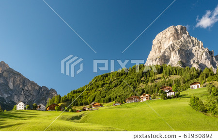 Corvara village, alpine village in Dolimite Alps at sunny summer day, Italy 61930892