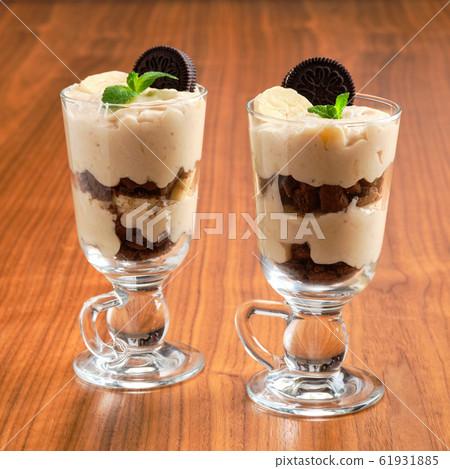 Sweet dessert with biscuit crumble, banana and Sweet dessert with biscuit crumble, banana and 61931885