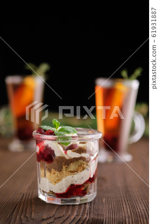 Delicious tiramisu dessert with cherry and citrus 61931887