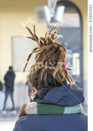 closeup head of a woman has Rastafarian hairstyle 61931921