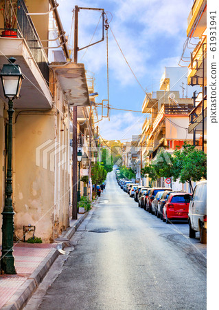 Deserted old narrow street of Loutraki in Greece 61931941