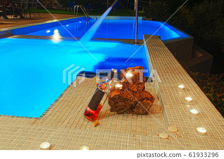 two glasses and bottle of wine at poolside, two glasses and bottle of wine at poolside, 61933296