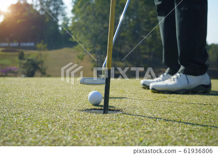 Golfer playing golf in beautiful golf course in Golfer playing golf in beautiful golf course in 61936806