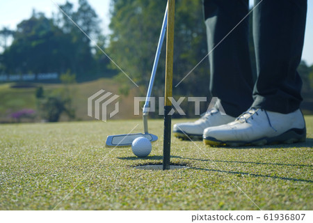 Golfer playing golf in beautiful golf course in Golfer playing golf in beautiful golf course in 61936807