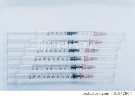 Medicine, Injection, vaccine and disposable syringe isolated, drug concept. Sterile vial medical. Macro close up on backgrounds gray. 61942904