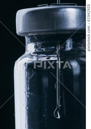 Medicine, Injection, vaccine and disposable syringe, drug concept. Sterile vial medical syringe needle. Glass medical ampoule vial for injection. Medicine, Injection, vaccine and disposable syringe, drug concept. Sterile vial medical syringe needle. Glass medical ampoule vial for injection. 61942928