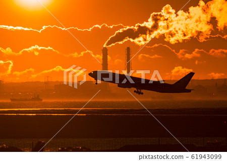 Jet airliner taking off in the morning sun Jet airliner taking off in the morning sun 61943099