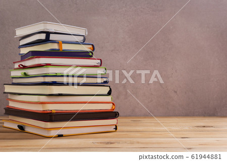 notepad or paper notebook at wooden table notepad or paper notebook at wooden table 61944881