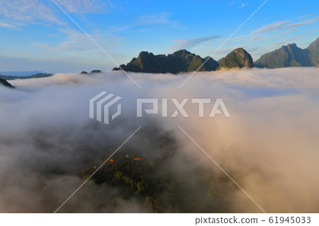 Landscape with sea of clouds in Vang Vieng, Laos Landscape with sea of clouds in Vang Vieng, Laos 61945033
