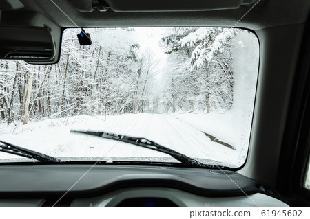 Driving the snow road 61945602
