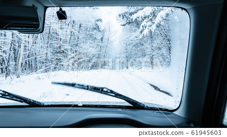 Driving the snow road 61945603