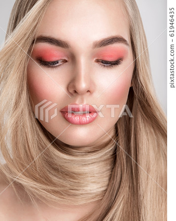 Portrait of a beautiful woman with a coral color Portrait of a beautiful woman with a coral color 61946435