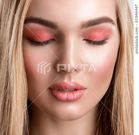 Portrait of a beautiful woman with a coral color Portrait of a beautiful woman with a coral color 61946447