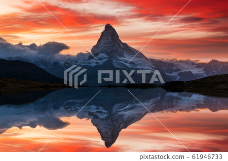 Matterhorn peak reflected in Stellisee Lake in Zermatt, Switzerland. Matterhorn peak reflected in Stellisee Lake in Zermatt, Switzerland. 61946733
