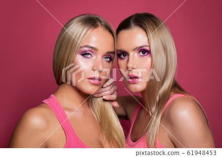 Pretty women faces. Two young woman  61948453