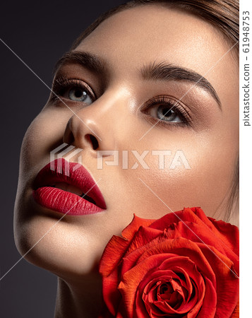 Beautiful young fashion woman with red lipstick. 61948753