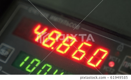 Electronic digital dial meter counter pipe. Manufacture of plastic water pipes factory. Process of making plastic tubes on the machine tool with the use of water and air pressure. 61949585