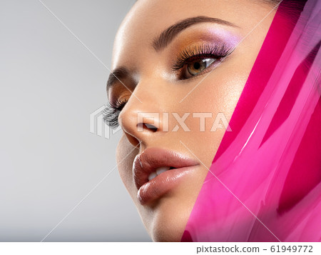 Beautiful white girl with bright eye-makeup. Beautiful white girl with bright eye-makeup. 61949772