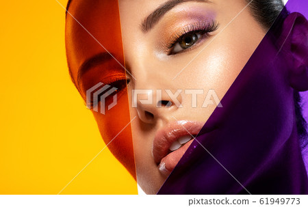 Beautiful white girl with bright eye-makeup. 61949773