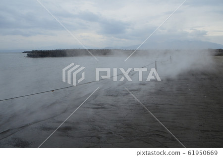 Steam entering the sandy beach - Sand steaming hot spring (Ibusuki city, Kagoshima prefecture) 61950669