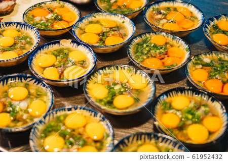 Street food at night in Phu Quoc island in Vietnam. Delicious bowl of egg display for tourist at Street food at night in Phu Quoc island in Vietnam. Delicious bowl of egg display for tourist at 61952432