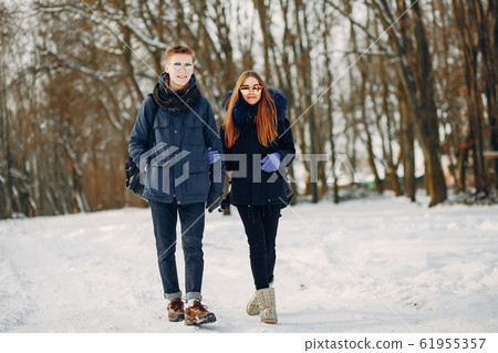 couple in a wood couple in a wood 61955357