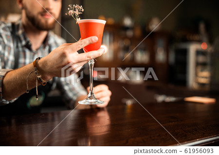 Bartender showing beautiful drink at the bar 61956093
