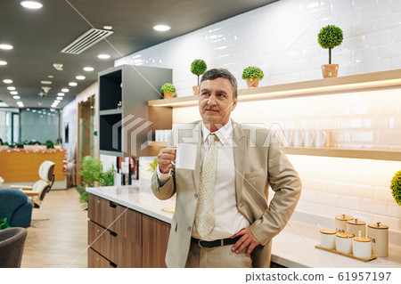 Caucasian Businessman On Coffee Break 61957197