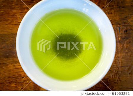 Photo of high-quality green tea. Japanese drink. Photo of high-quality green tea. Japanese drink. 61963221