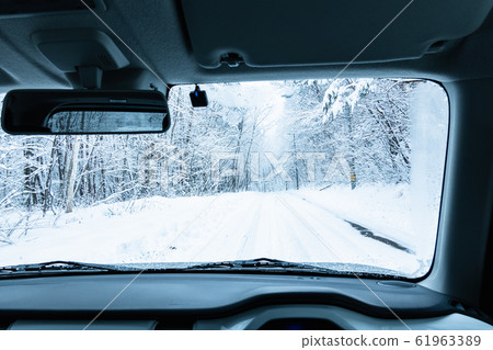 Driving the snow road Driving the snow road 61963389