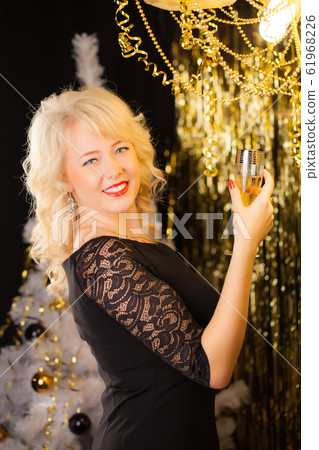 Attractive young blonde girl on a holiday Attractive young blonde girl on a holiday 61968226